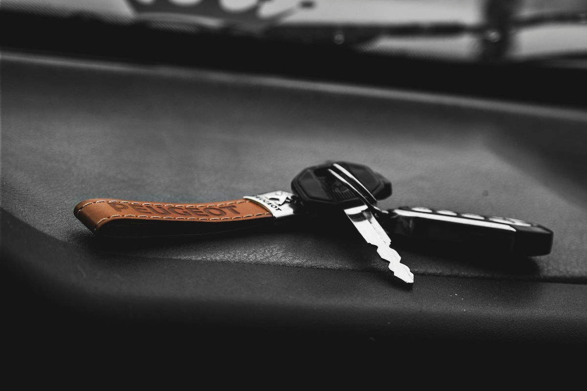 Car keys resting on a dashboard, symbolizing license reinstatement and driving privileges.